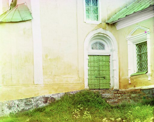 Entrance to building, with metalwork on door and window