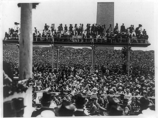 Photographers on platform above crowd at Charles A. Lindbergh speech at the Washington Monument in Washington, D.C.