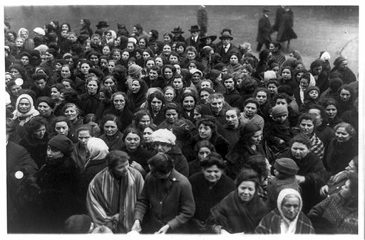 Throng of women charge on New York city hall to demand bread