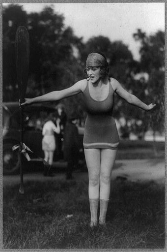 Mack Sennett girl in bathing suit holding up oar