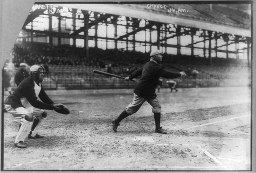 Frank Chance, manager for the New York American League baseball team swinging bat