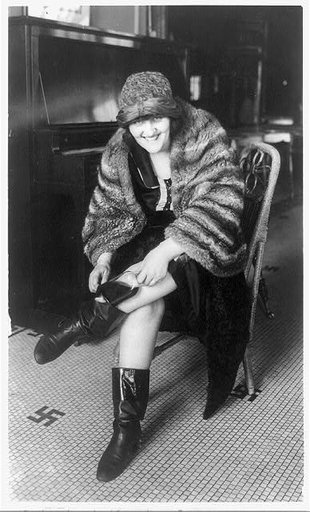 Woman putting flask in her Russian boot, Washington, D.C.