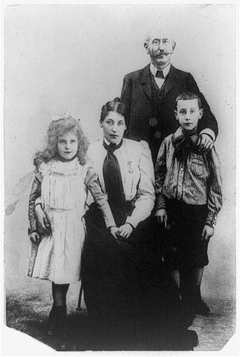 Capt. Alfred Dreyfus, full-length portrait, standing, facing front, with wife(?) and two children