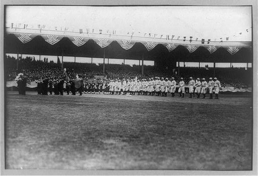 Baseball, opening day showing Brooklyn team and band on stadium field