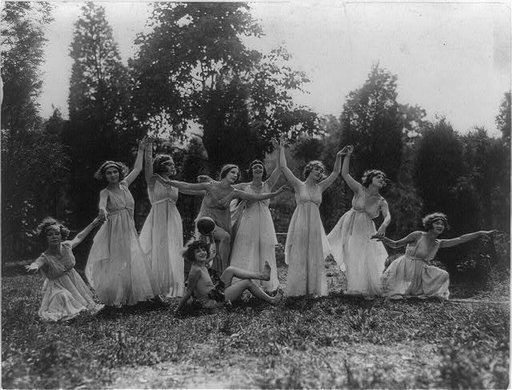 Eight women and one child(?) performing Greek dance outdoors, Washington, D.C. area