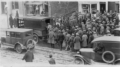 Police raid a gambler's den. Several loads of book makers were taken from the E. St. address by the police