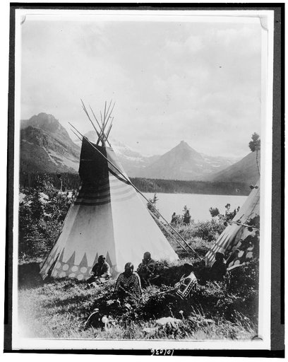 Indian with two tepees beside a lake in Rocky Mountain National Park, Colorado