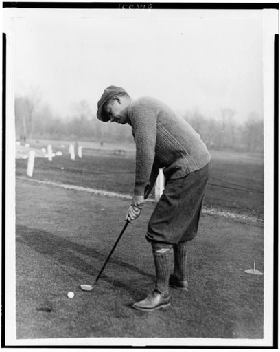 Reinald Werrenrath, American operatic baritone, putting golf ball