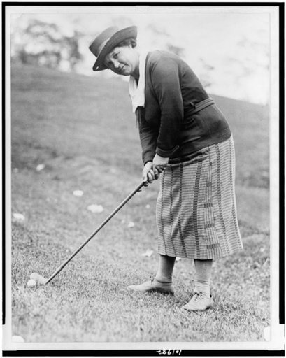 Mrs. Defarge(?), full-length portrait, standing, facing left, bending over with golf club, Washington, D.C. area(?)