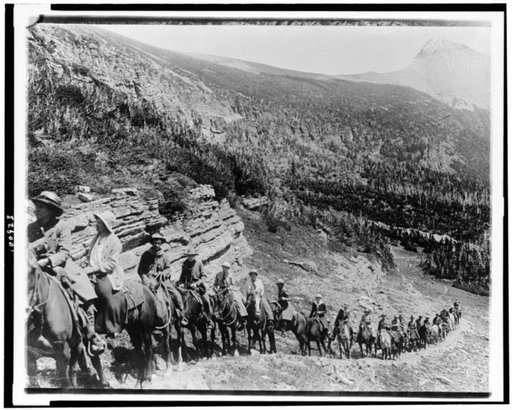 People on horseback going up mountain in Rocky Mountain National Park, Colorado