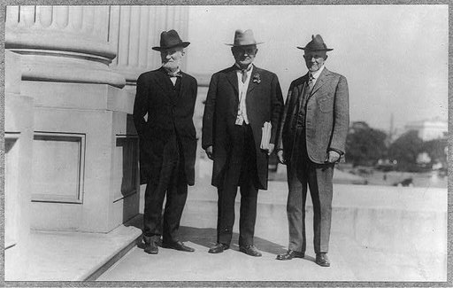 Posed full length, standing left to right: Joseph Gurney Cannon, Champ Clark, and Frederick Huntington Gillett on U.S. Capitol steps