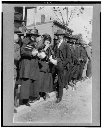 Baseball fans, including women, waiting in line for ball grounds to open