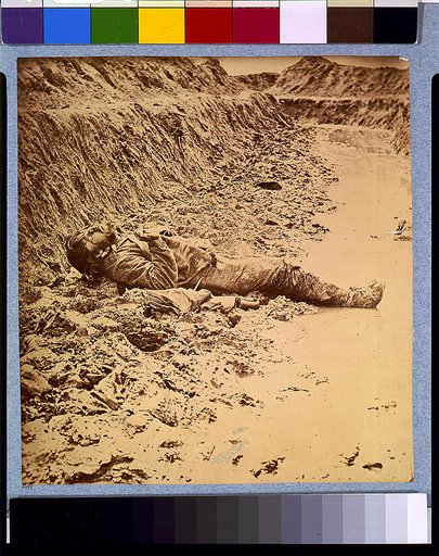 Dead Confederate soldier, in trenches of Fort Mahone in front of Petersburg, Va., April 3, 1865