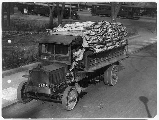 Truck load of beef being delivered to Central Market, Washington, D.C.; black driver