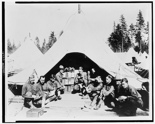 U.S. soldiers reading books in front of tent, Vancouver barracks