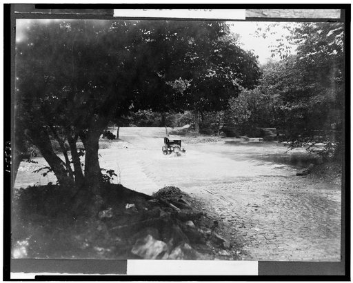Car in stream in Rock Creek Park(?), Washington, D.C.