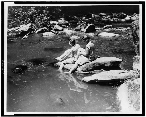 Marion Newton and Ruth Williams preparing to wade in Rock Creek, after suffering with the intense heat of the past two days, when the thermometer recorded 104 degrees