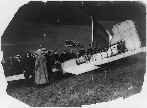 Louis Blériot with his plane after landing at Dover, 1909