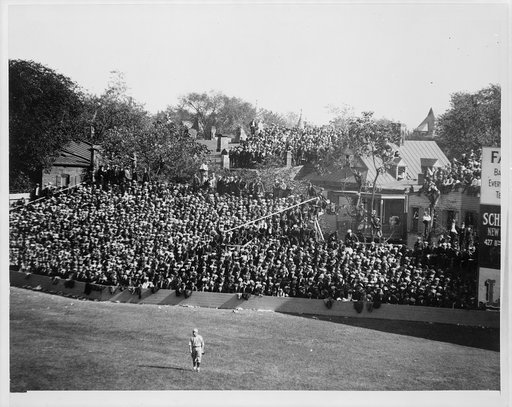 Baseball game at old Griffith Stadium, Washington, D.C., view of spectators and one player on field