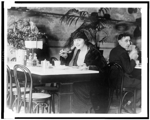 Woman eating in a restaurant