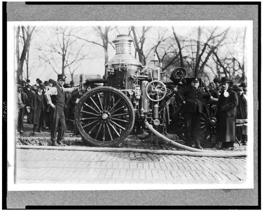 Two firemen with fire engine