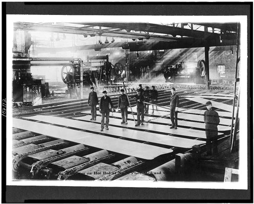 Laying out plates on hot bed at no. 1 plate mill ...