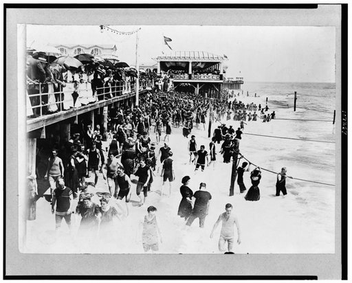 People on beach and boardwalk at Asbury Park, New Jersey