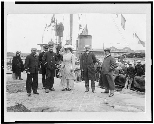 Louis Blériot with his wife on return to Calais, France, with ship behind them
