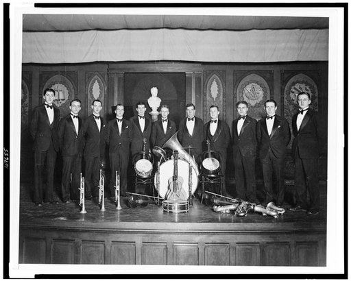 Eleven musicians posed with their musical instruments, in the Washington, D.C. area