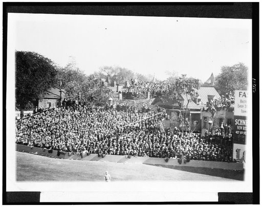 Temporary left field bleachers and the only housetops afording [sic] a view of the grounds.  World Series second game