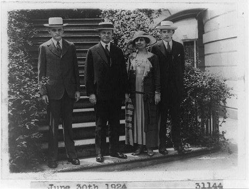 Pres. and Mrs. Calvin Coolidge and sons, full-length portrait, standing on steps