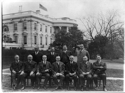 President Coolidge and members of his cabinet posed on the White House Lawn: Secty. of Labor Davis, Secty. of Agriculture Wallace, Secty. of Commerce Hoover, Post Master Gen., Secty. of War Weeks, Secty. of State Hughes, the President, Secty. of Treasury Mellon, Atty. Gen. Stone and Sect. of Navy Wi