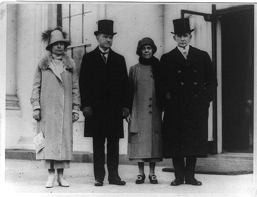 President and Mrs. Coolidge with Vice President and Mrs. Dawes, standing, full-length, on North Portico of the White House