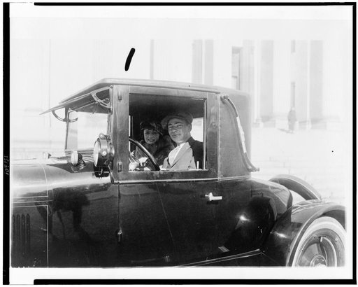 Man and woman, in automobile, in the Washington, D.C., area