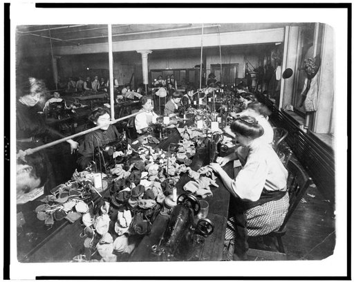 People making teddy bears in factory