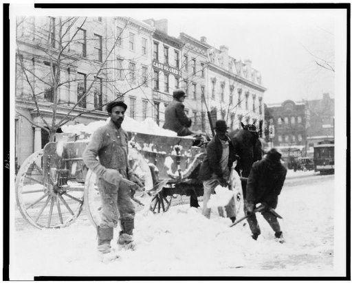Men loading snow onto wagon, after snow storm, in Washington, D.C.(?)