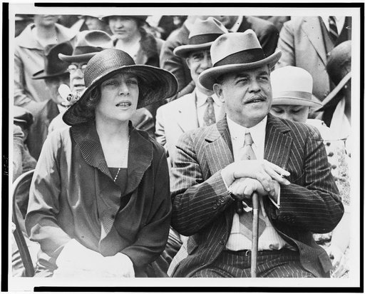 Representative and Mrs. Nicholas Longworth snapped on the Capitol steps today, as they watched the Indians from Arizona put on their snake dance