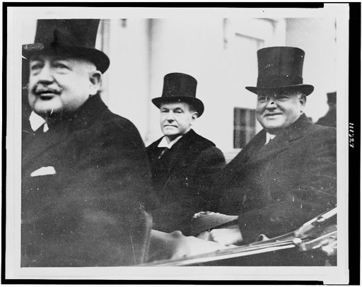 Calvin Coolidge, Herbert Hoover, and an unidentified man, driver(?), in an automobile