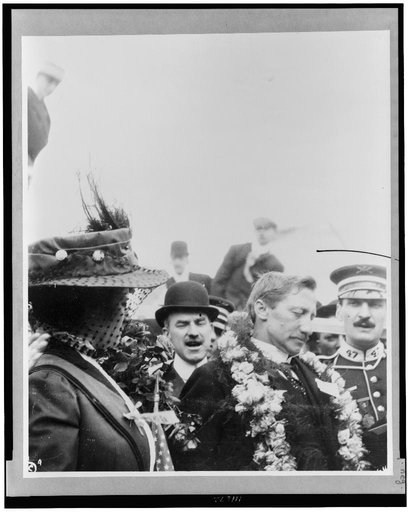 Dr. Frederick A. Cook and wife on ship, Grand Republic, head-and-shoulders portraits, facing right