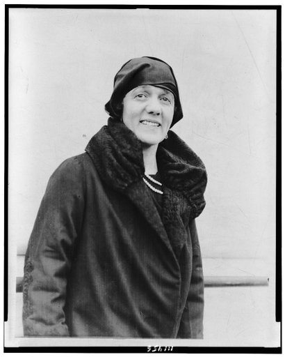 Mrs. Dorothy Harrison Eustis, half-length portrait, standing, on ship(?), facing slightly right