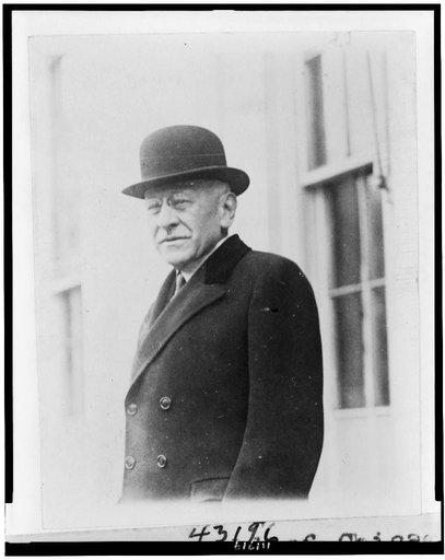 Julius Rosenwald of Chicago, President of Sears, Roebuck and Co., half-length portrait, standing outside the White House, facing left