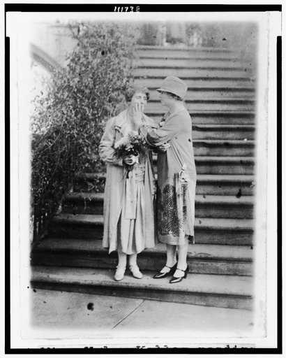 Helen Keller reading Mrs. Calvin Coolidge's lips, with her hand