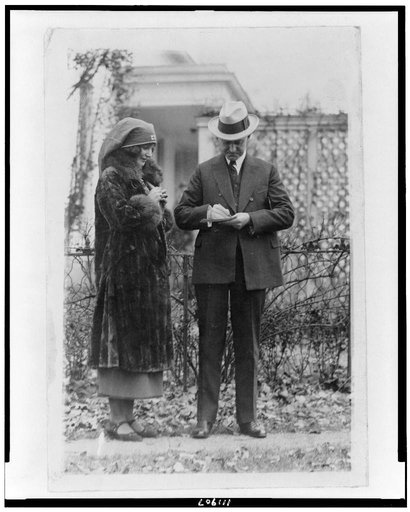 Miss Janet Moffett signing up President Coolidge for the Red Cross drive