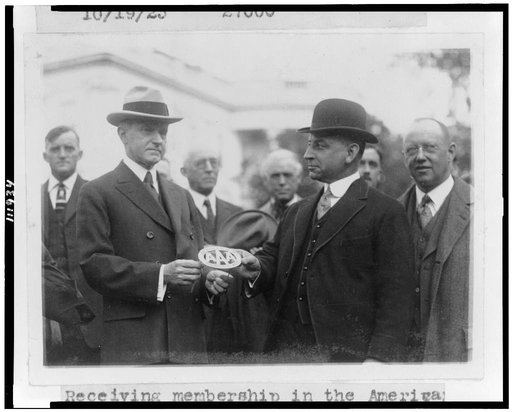 President Coolidge receiving membership in the American Automobile Association