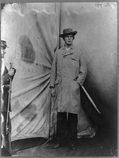 Lewis Payne, Lincoln conspirator, full-length portrait, standing in front of tent, facing right