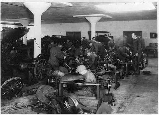 Men assembling automobile parts at an auto school in Washington, D.C.