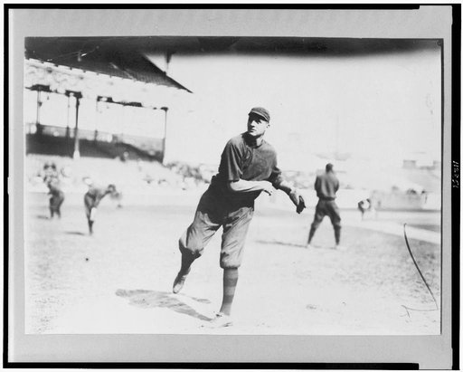 William Lawrence James, Boston NL baseball player, throwing ball on baseball field