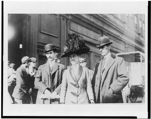 Orville Wright, William Wright, and Katharine Wright, half-length portraits, standing outdoors