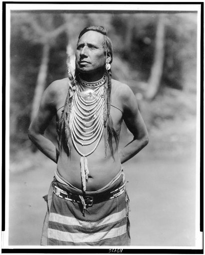 Chief Stabbed-by-Nustah(?)--one of the council protesting against change of names of mountains, lakes, rivers and waterfalls in Glacier National Park--of the Blackfeet Tribe