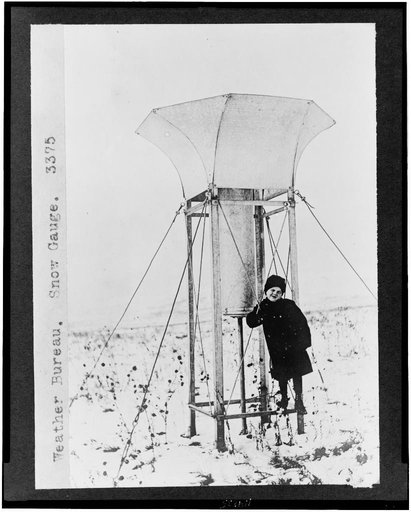Child standing on snow gauge of the Weather Bureau
